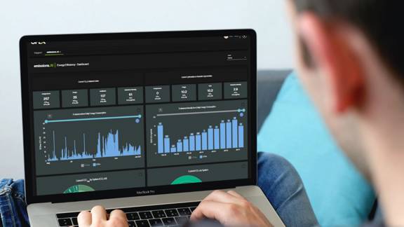 OPEX employee looking at data on a laptop screen.