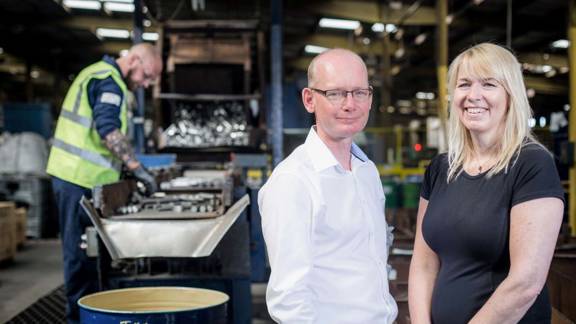 Rosie Hill and Brian Carolan from Ireland Alloys with David Dickson working in the background