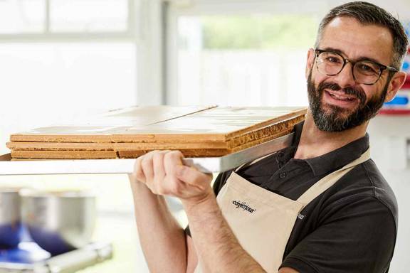 Dario Riccomini from Aldomak holding a tray of tablet.